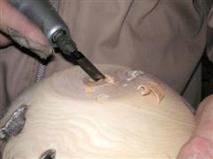 Using a carving tool to remove the nub